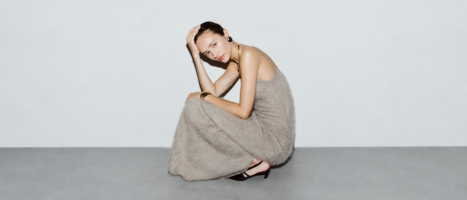 Modern womenswear styled in a refined editorial setting